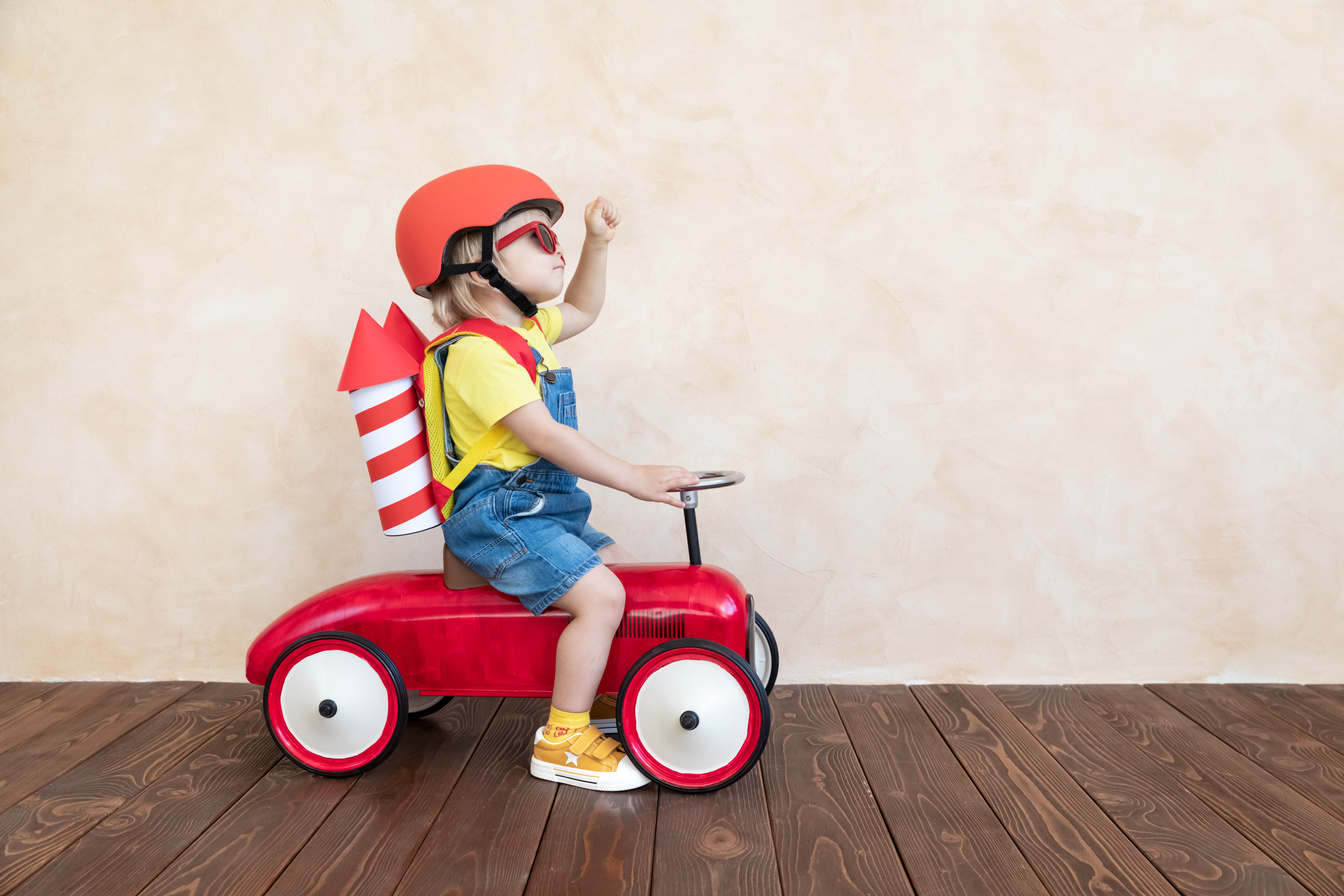 Kid Playing with Toy Rocket at Home