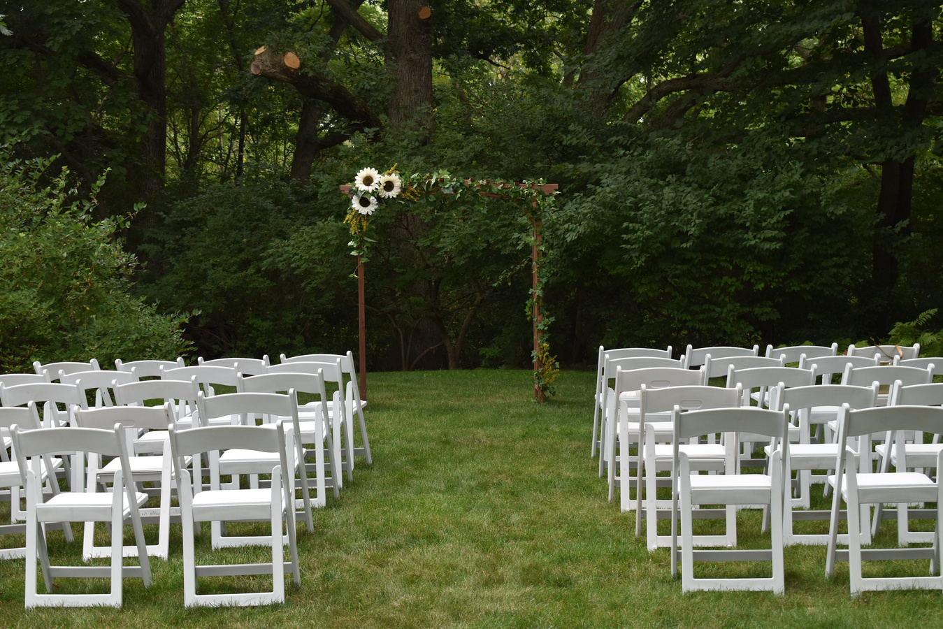 Chairs and Arch Outdoors for Wedding Ceremony